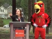 Council Member Linley Jones (with Harry the Hawk) addresses the crowd in attendance.