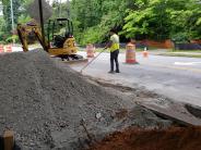 Crews work on a driveway lane in front of Montgomery Elementary School.