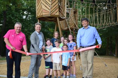 Parks Director Brian Borden, Mayor John Ernst and City Councilmember John Park join fans of the Briarwood Park Treehouse.