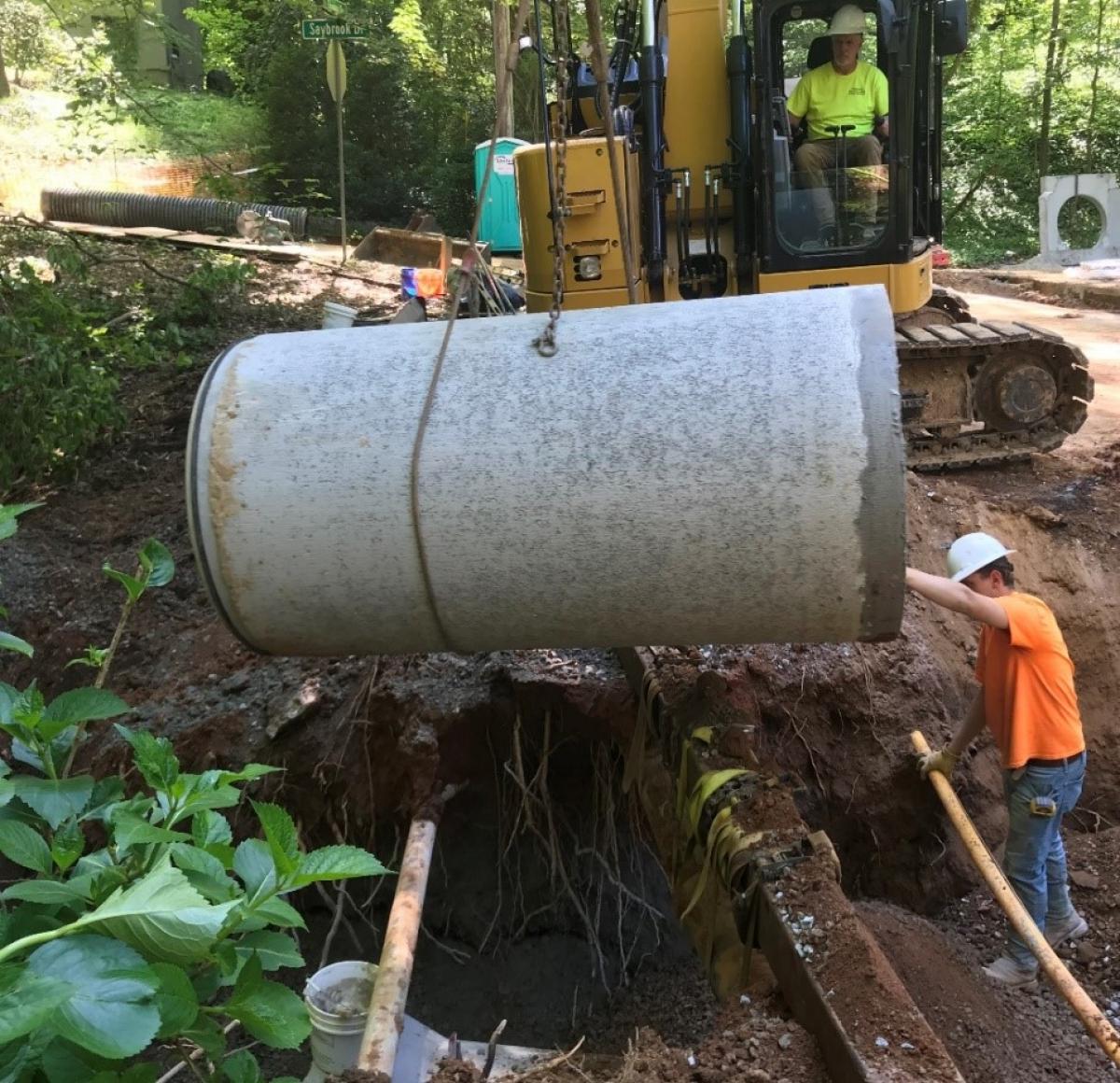 Crews complete an overhaul of stormwater infrastructure at Inman and Saybrook Drive in March 2020, replacing multiple pipes.