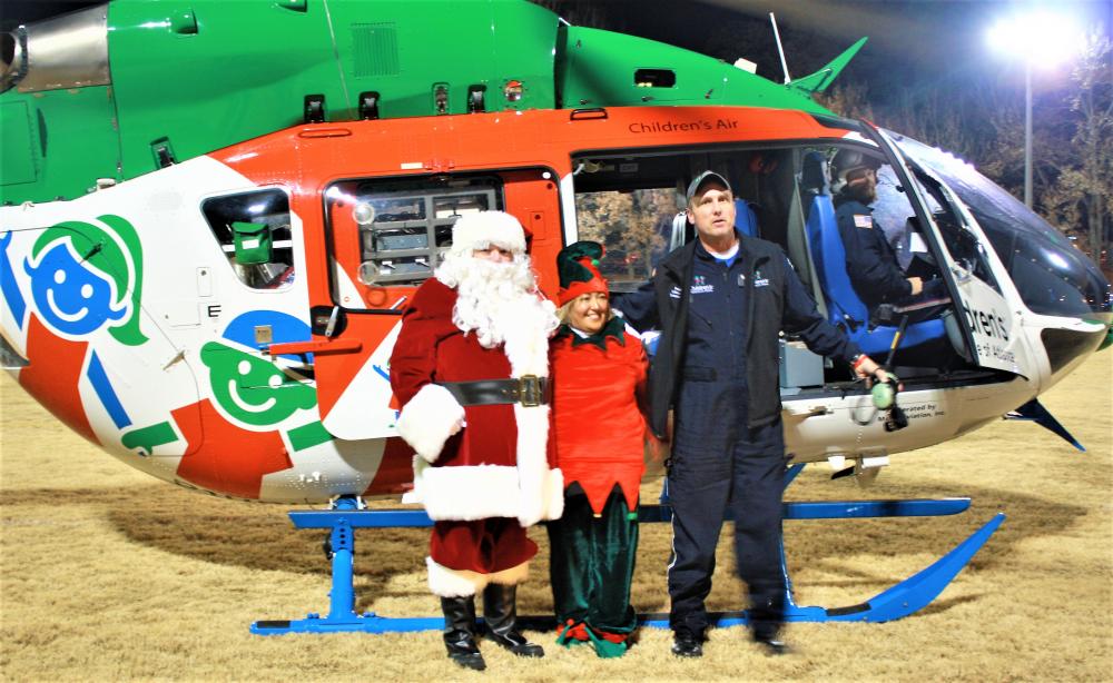 Swoosh! Santa sweeps in via chopper to greet Light Up Brookhaven guests