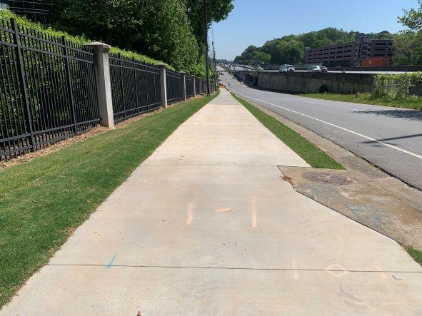 A pedestrian walks through Town Brookhaven, a mixed-use